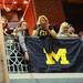 Michigan fans shout from a balcony in hopes of receiving beads during the Outback Bowl New Year's eve parade in Ybor City, Fla. on Monday night. Melanie Maxwell I AnnArbor.com
